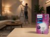 Ketika Rumah Jadi Pusat Kehidupan, Pencahayaan Jadi Penentu Kualitasnya Kotak kemasan lampu philips UltraBright dengan latar belakang orang sedang memasang lampu